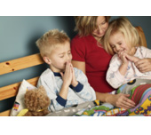 Picture of a mother and two kids praying