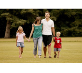 Picture of a family walking in a park