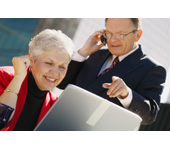 Picture of a woman and man looking at a computer screen