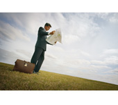 Picture of a man reading a map